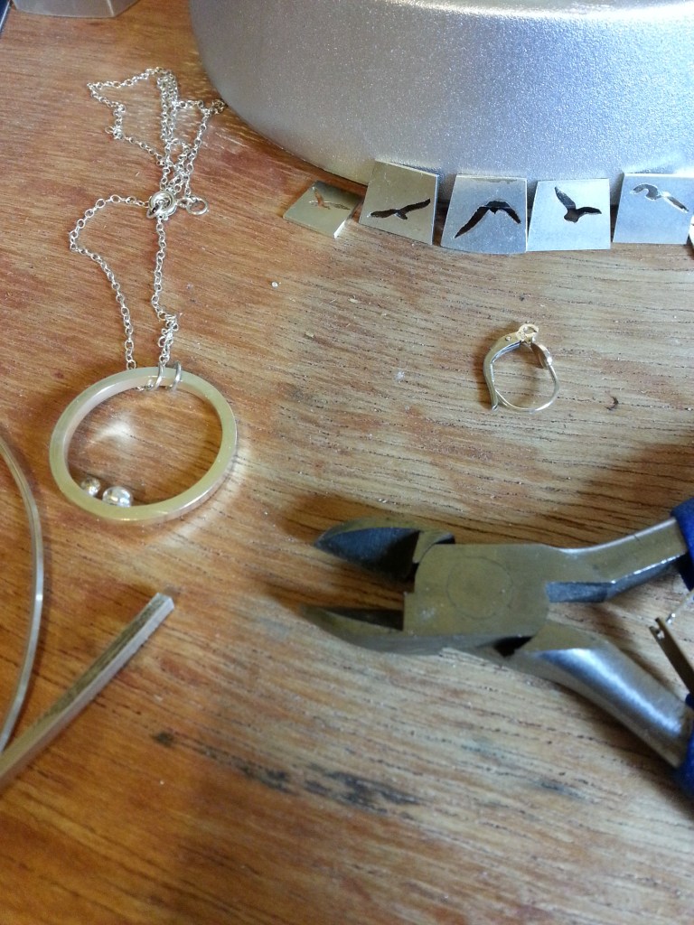 Tools and jewellery work-in-progress on the bench